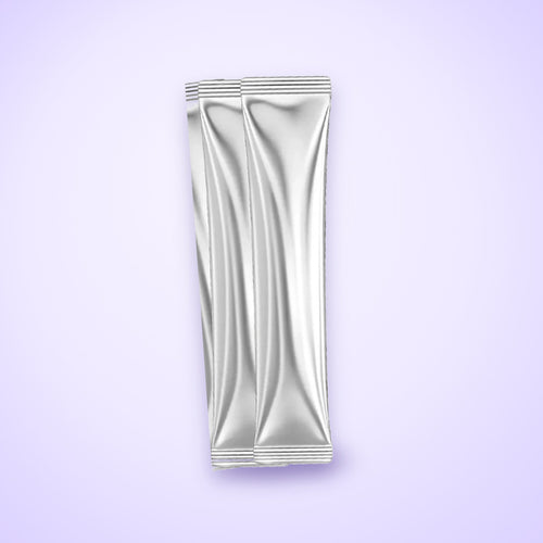 Two Reludor Purple Rinse single-dose sachets on a lavender background